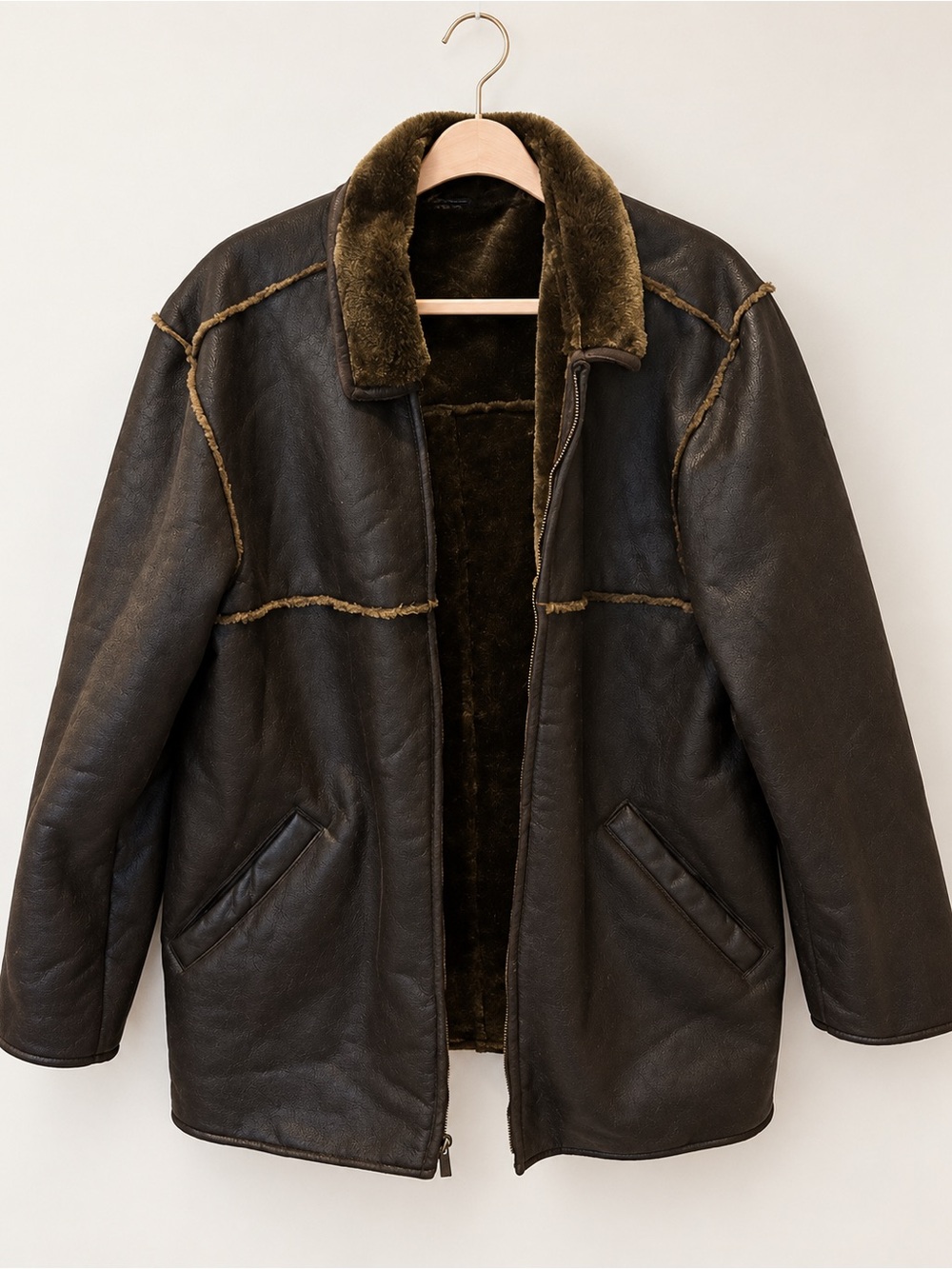 Men’s brown leather/shearling-style coat in size Medium.